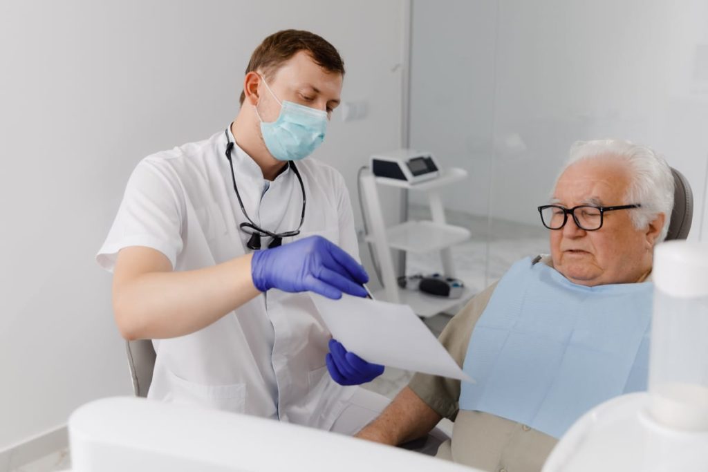 Dental professional showing patient results