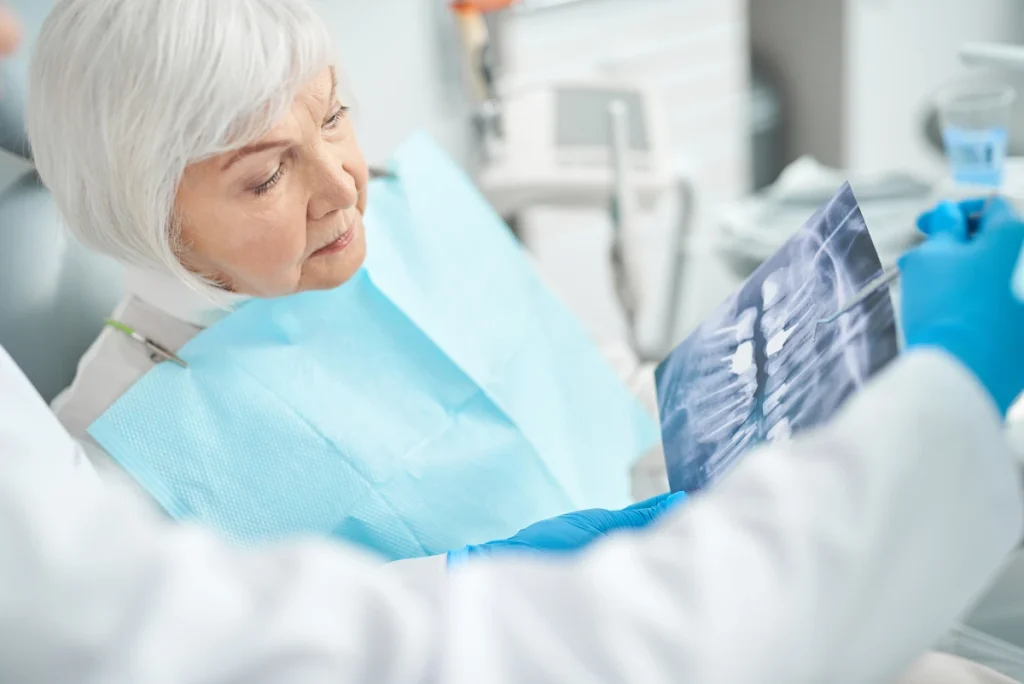 Patient looking at an x-ray of their teeth